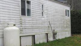 Powerwashing vinyl siding before